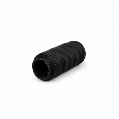 Close view of black weaving thread on spool