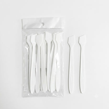 Single white plastic esthetics spatula