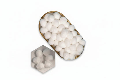 Loose cotton balls shown outside packaging