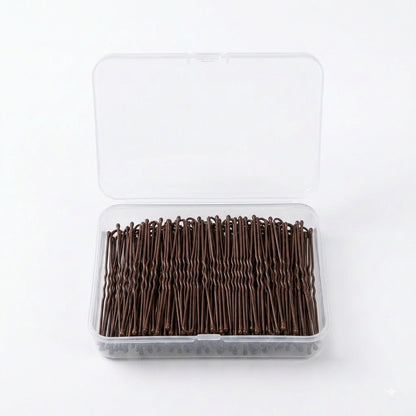 Long bronze hair pins in open box